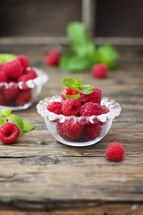 Fresh sweet raspberry on the wooden table