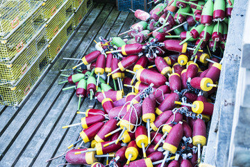 Fototapeta premium Lobster traps and buoys stored on a pier