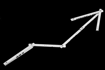 Zollstock als Trendpfeil