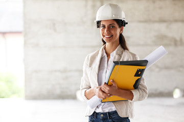 Portrait of female architect at the construction site.