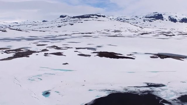 The lake in Hardangerfjorden is covered with ice.