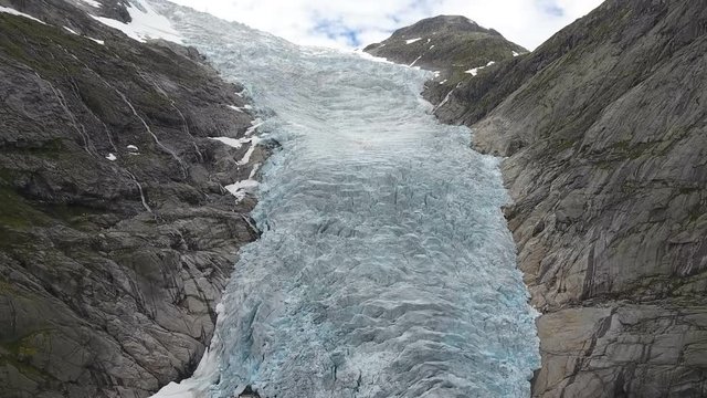 A view of the glacier located between the two mountains. Jostedalsbreen. Norway