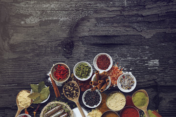Various spices and powders on a wooden surface