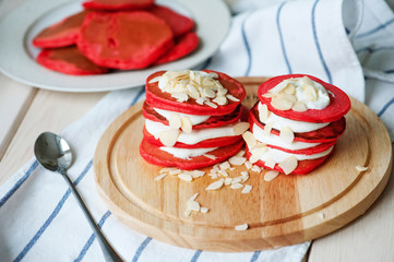 Red pancakes whis almond flakes