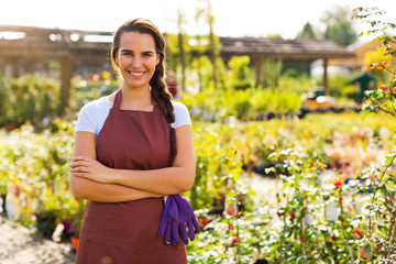 Smiling employee in garden center
