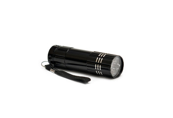 Metal LED flashlight on white background