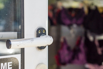 Close-up of an open door in aunderwear shop. Shallow depth of focus. Concept shopping.