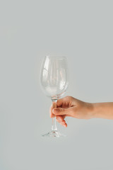 woman holding empty wine glass