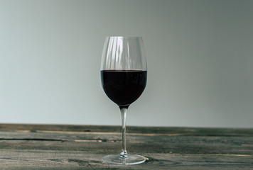 Glass of red wine on table