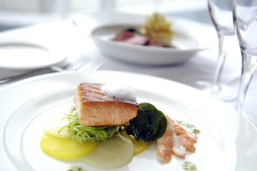 Gourmet Fried Salmon Dish with Shrimp and Vegetable Slices