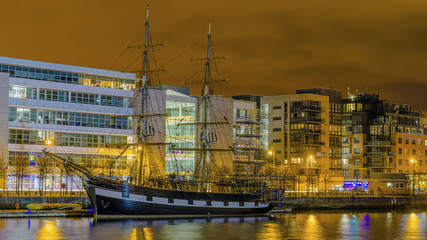 Dublin, Republic of Ireland, night view of The  Tall Ships and River Liffey