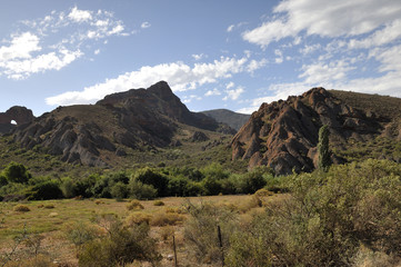 Landscape Photo Hills with Lush Greens Under Cloudy Blue Skies