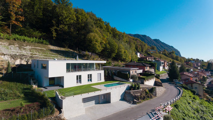 Fototapeta na wymiar Modern villa with swimming pool, aerial view