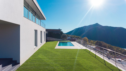 Luxury house with garden and swimming pool - obrazy, fototapety, plakaty