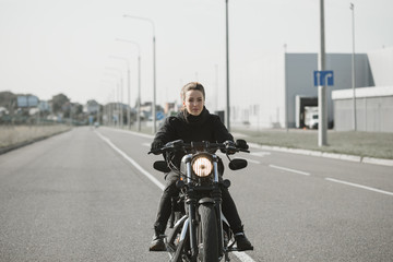 Fototapeta na wymiar Biker Woman on motorcycle