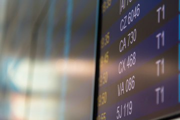 Flight information on airport arrivals departures board, timetable and schedules