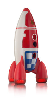 Red blue and white toy plastic childs rocket with reflection isolated on white