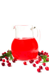 Drink juice from berries of cranberries in glass
jars on white background isolate with copy space