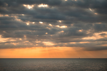 dark clouds over the sea at sunset on a summer evening