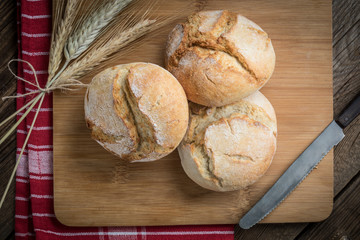 Roll breads on cutting board.