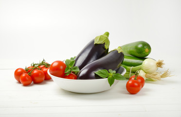 fresh eggplants, tomatoes, zucchini and spring onion