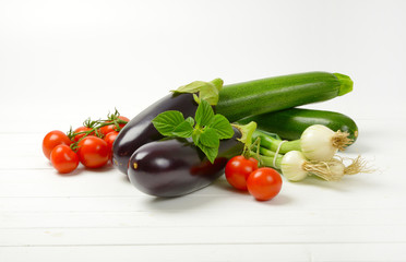 fresh eggplants, tomatoes, zucchini and spring onion