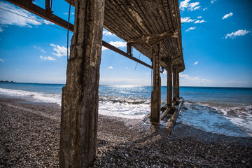 broken pier on the seashore