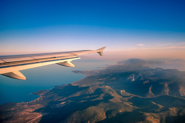 Fototapeta na wymiar Amazing view from the plane window at the sky the aegean sea and the island of Lesvos.