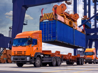 Industrial port crane lift up loading export containers box onboard from truck at port of Thailand,The port crane type's twinlift is the best solution for port operations.