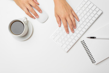 women's hands using keyboard and mouse