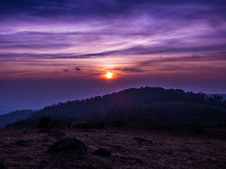 The sun rises between the cloud and mountainn in Mon Jong, Chiangmai, Thailand.