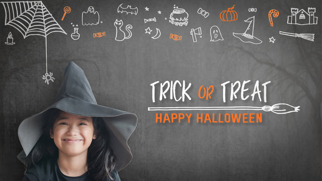 Trick or treat halloween girl kid having fun in witch hat black costume with funny doodle of spider web, jack o lantern and party decoration on spooky school chalkboard background