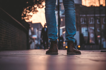 Obraz premium Worn boots on a busy street