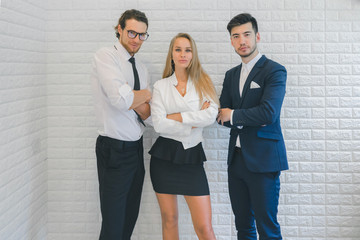 Professional business team looking forward confidently standing in office