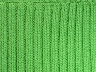 Texture of green woolen knitted background