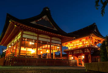 The red house or building and the entrance of Fushimi Inari Taisha where the great pillars or torii are lining in pattern which can be visited in Kyoto, Japan