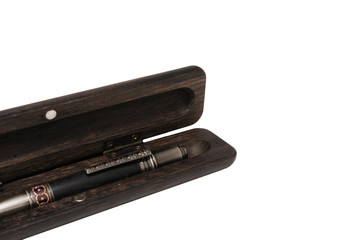 A pencil case for a ballpoint pen made from old oak on a white background