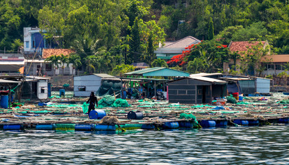 Floating fishing village, near the shore, in the sea bay, Vietnam © Nemo67