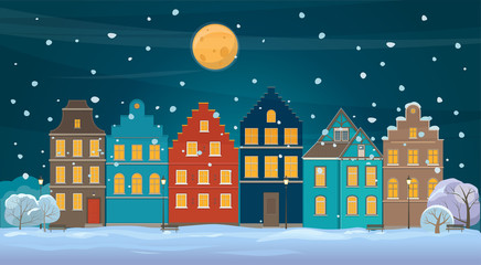 Winter background with old town at night