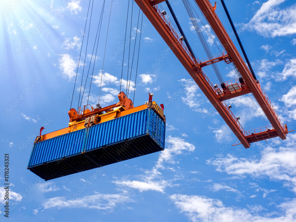 Sticker industrial port crane lift up loading export containers box onboard at port of thailand, look up und