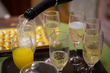 Champagne poured into a glass close-up