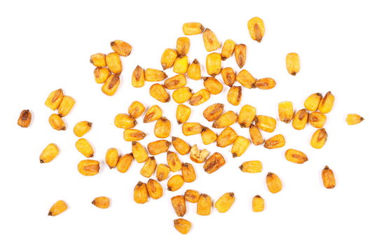 Fried salty corn grains isolated on white background, for popcorn, top view