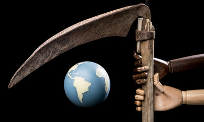 Earth threatened by a scythe holded by two hands.  Isolated on black background. With copy space text. Studio Shot.