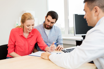 couple visiting doctor at family planning clinic
