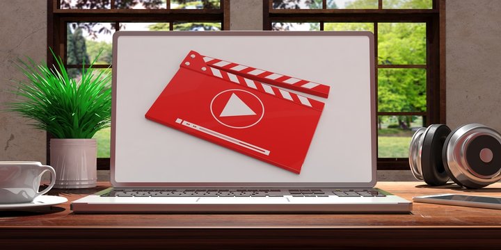 Laptop with video player screen on wooden desk at home. Beautiful blurred nature background. 3d illustration