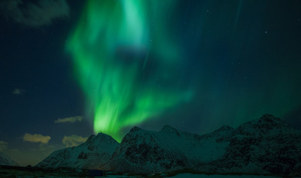 Northern lights (Aurora borealis) over the mountains. Norway, Lofoten