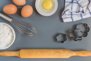 Eggs, flour, rolling pin, shape, corolla, baking ingredients with a copy of a stretch in a vintage style