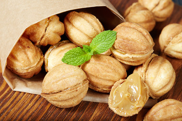 Cookies in a shape of nuts with condensed milk cream filling