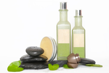 Obraz na płótnie Canvas Cosmetic products arranged with zen stones