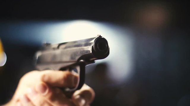 Hand Gun Being Pointed